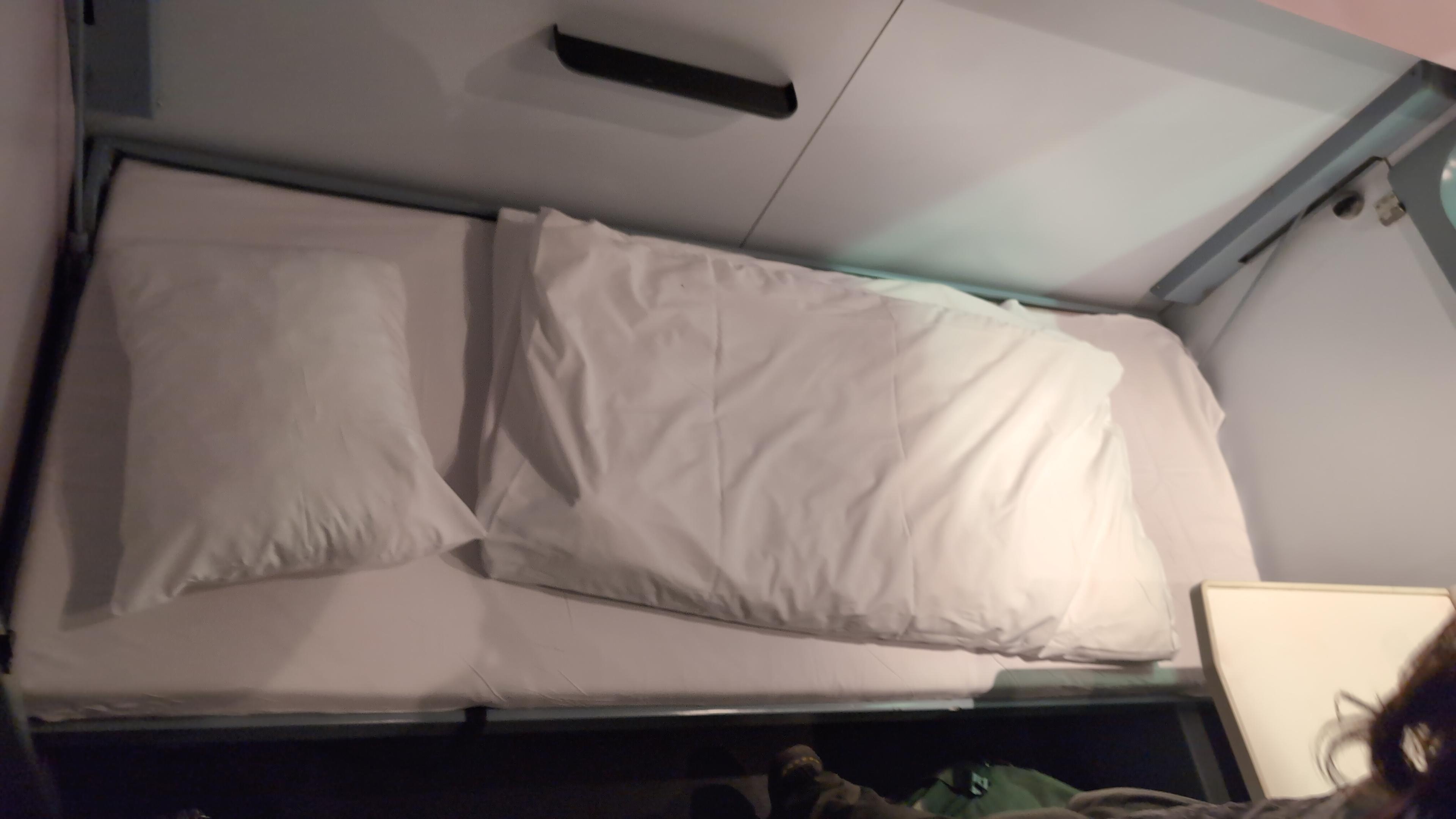 A made bed in a wagon-lits compartment.