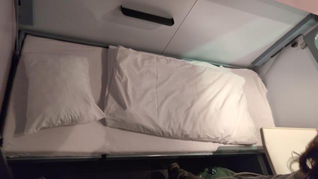 A made bed in a wagon-lits compartment.