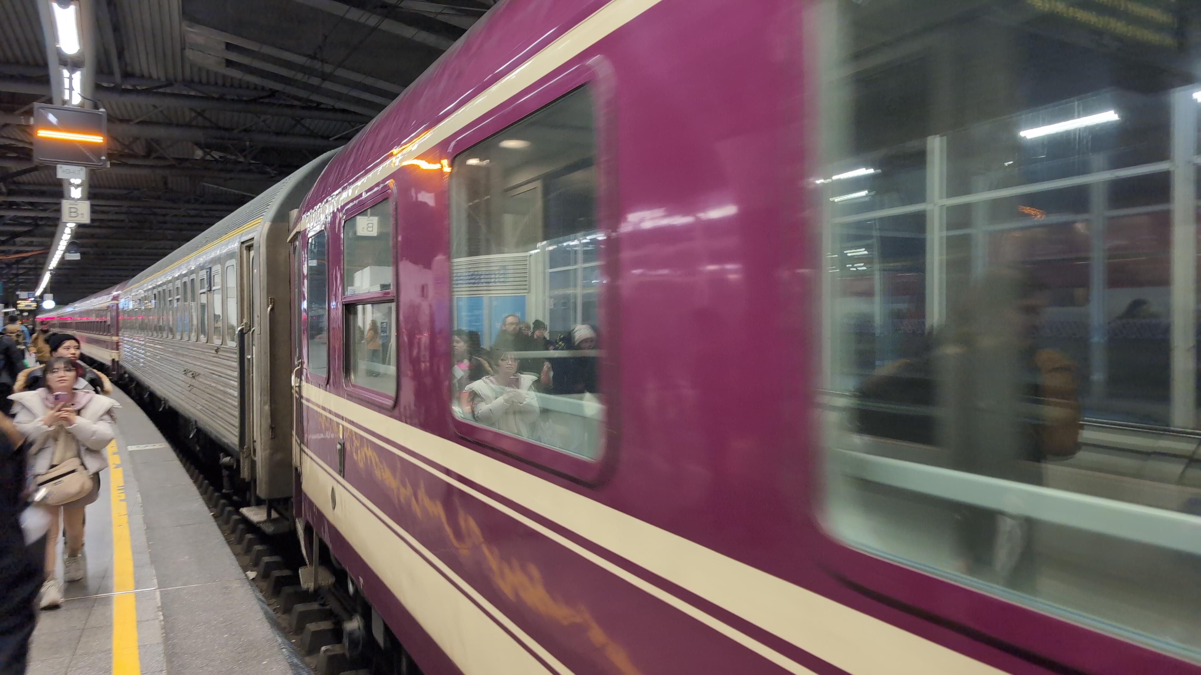 A night train arriving in Brussels. It consists of couchette and sleeper carriages.